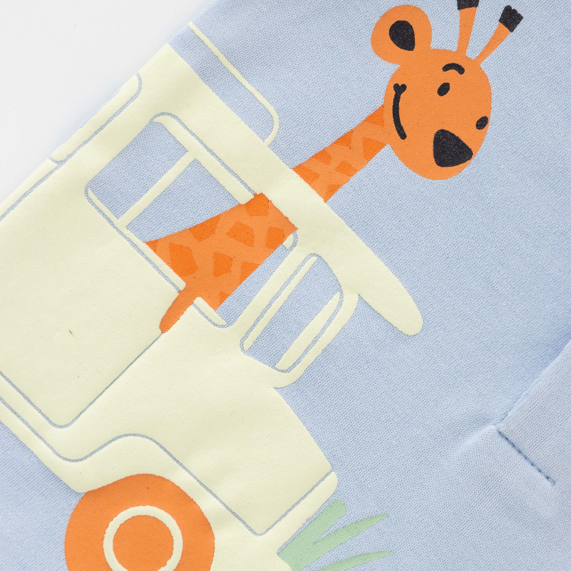 Illustration of a giraffe on a toy truck against a light blue background