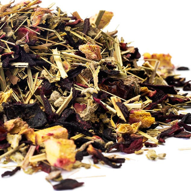 Assorted dried herbs and flowers on a white background
