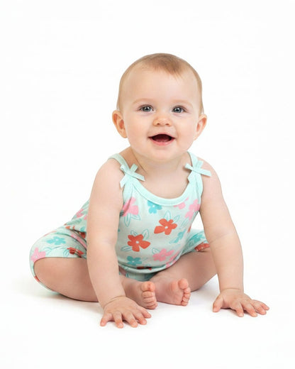 Floral-patterned baby romper on a white background