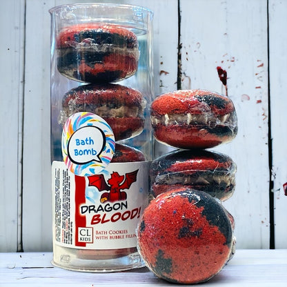 A stack and tube of red and black dragons blood bath cookies against a wood background