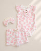 Baby outfit set with floral pattern on a beige background