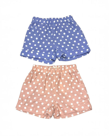 Two pairs of polka dot shorts, one blue and one pink, on a white background.