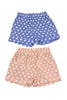 Two pairs of polka dot shorts, one blue and one pink, on a white background.