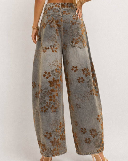 Floral-patterned wide-leg jeans on a plain background