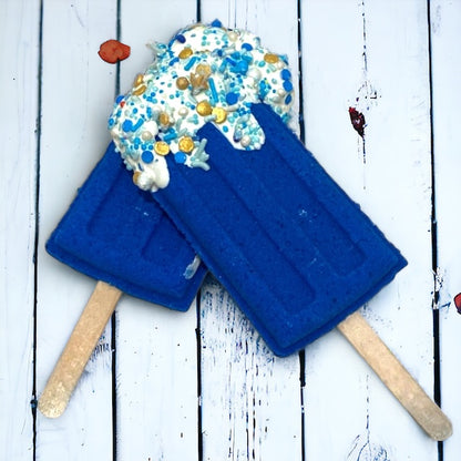 Two popsicle bath bomb - Blue  against a wooden background