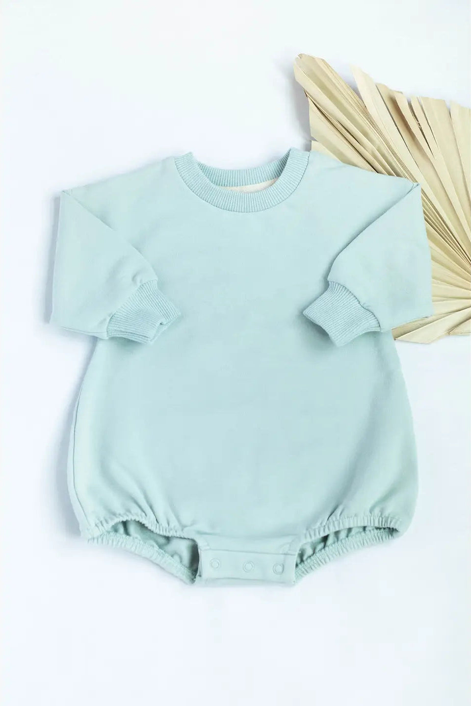 Light blue baby romper on a white background