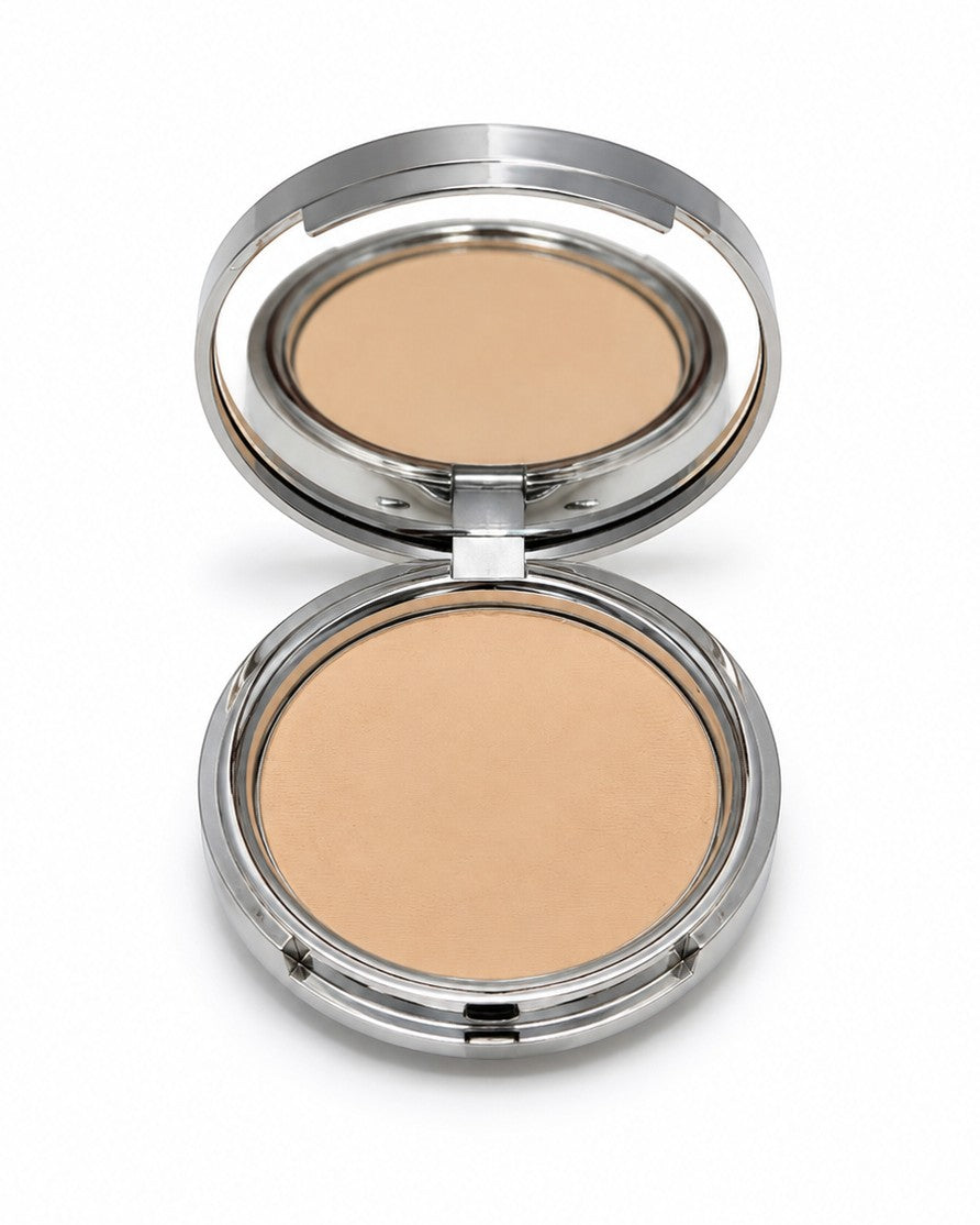Compact powder in a silver case on a white background