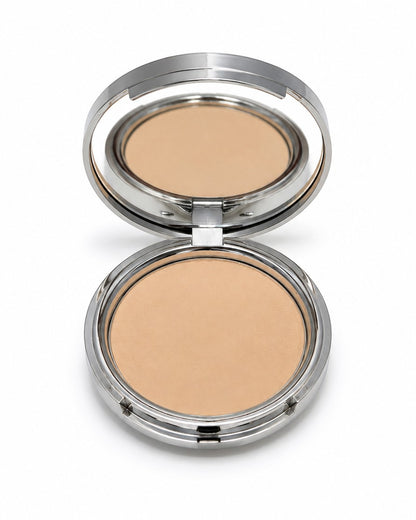 Compact powder in a silver case on a white background