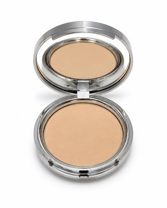 Compact powder in a silver case on a white background