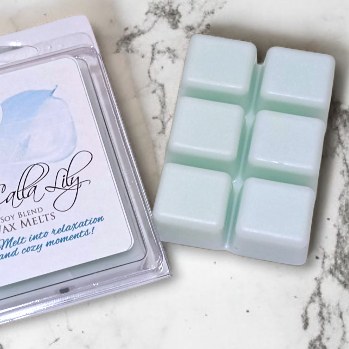 Packaged candle wax melts with a marble background