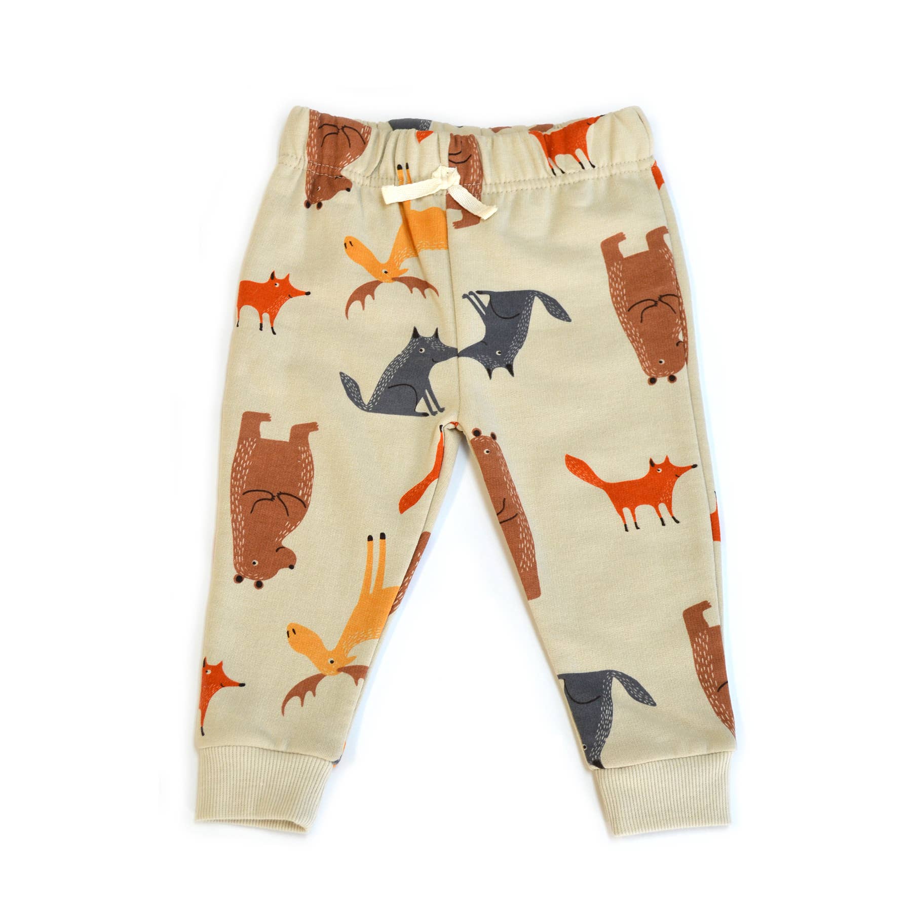 Children's pants with fox pattern on a beige background
