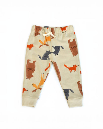Children's pants with fox pattern on a beige background