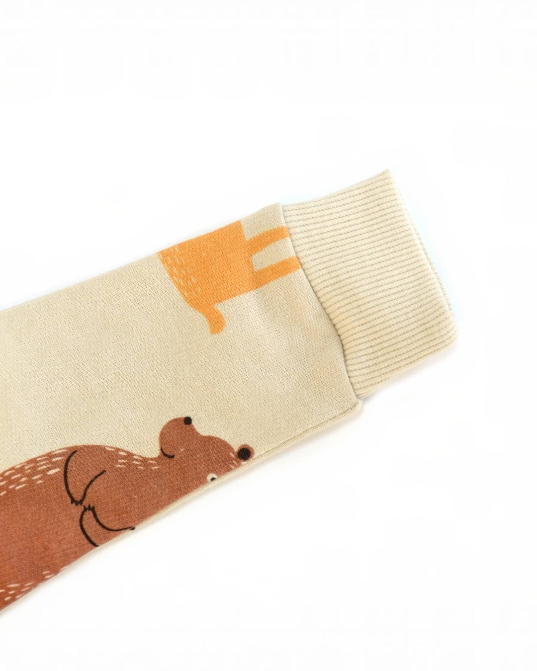 Beige sock with brown bear design on a white background
