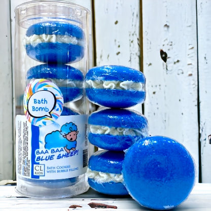 A stack and tube of blue sheep bath cookies against a wood background