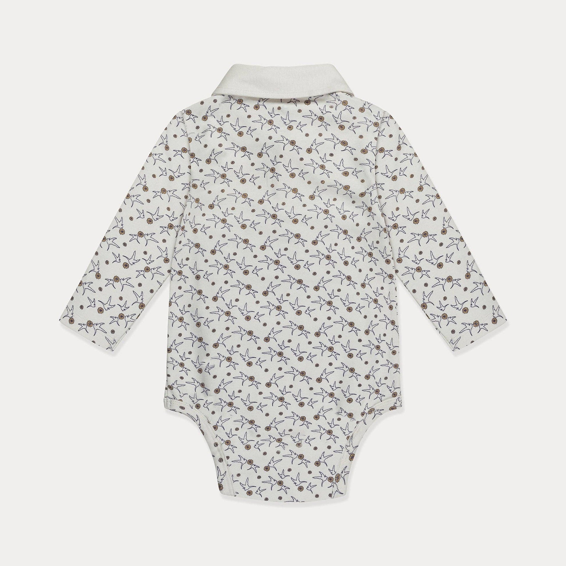 Baby onesie with a floral pattern on a white background