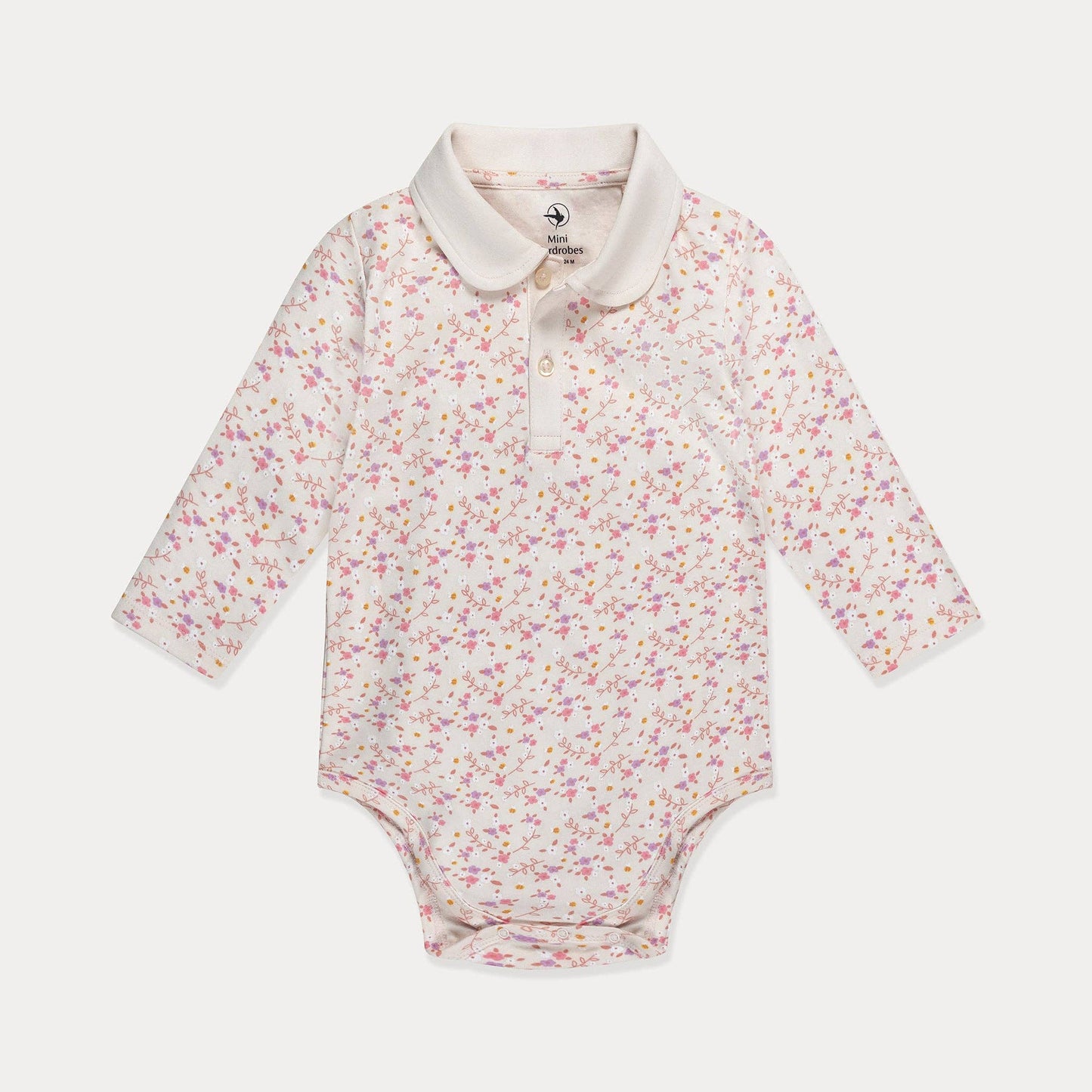 Floral-patterned baby bodysuit with a white collar on a light gray background