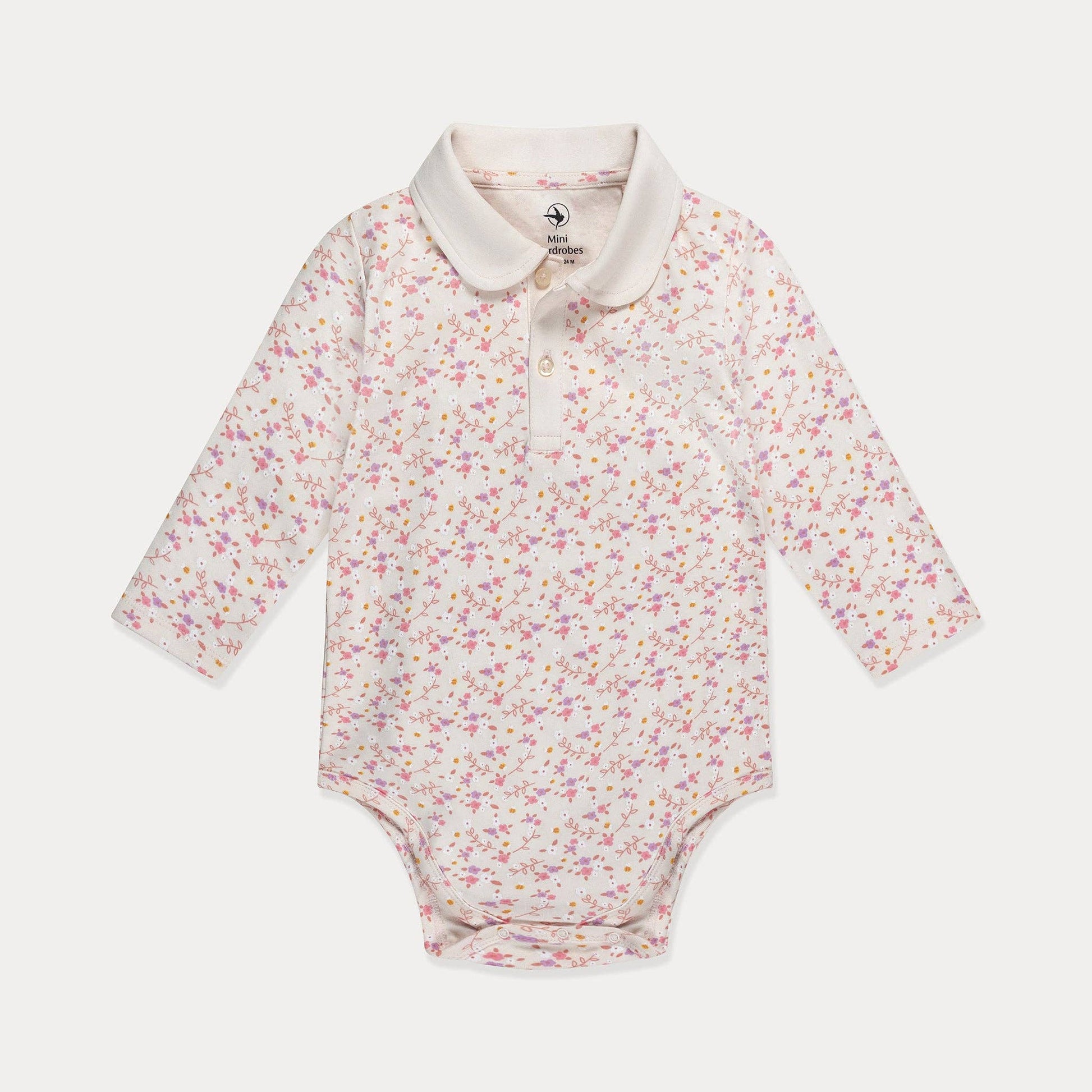 Floral-patterned baby bodysuit with a white collar on a light gray background