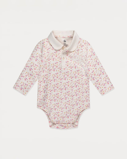 Floral-patterned baby bodysuit with a white collar on a light gray background