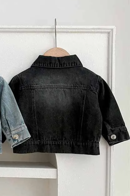 Two denim jackets, one blue and one black, on hangers against a white background.