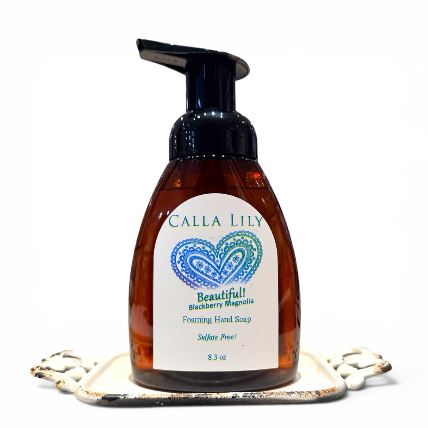 Brown foaming hand soap bottle with a Calla Lily label on a white background