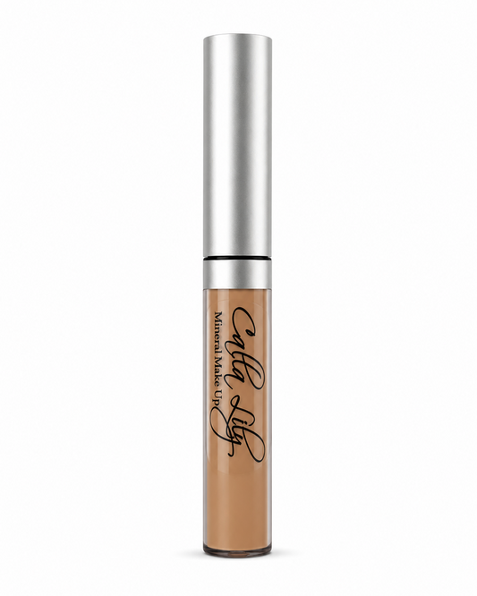 Cosmetic concealer with silver applicator on a white background