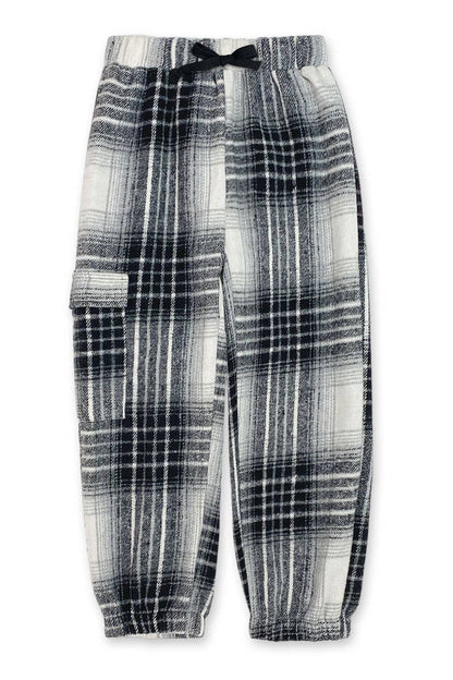 black and white plaid pants on white background