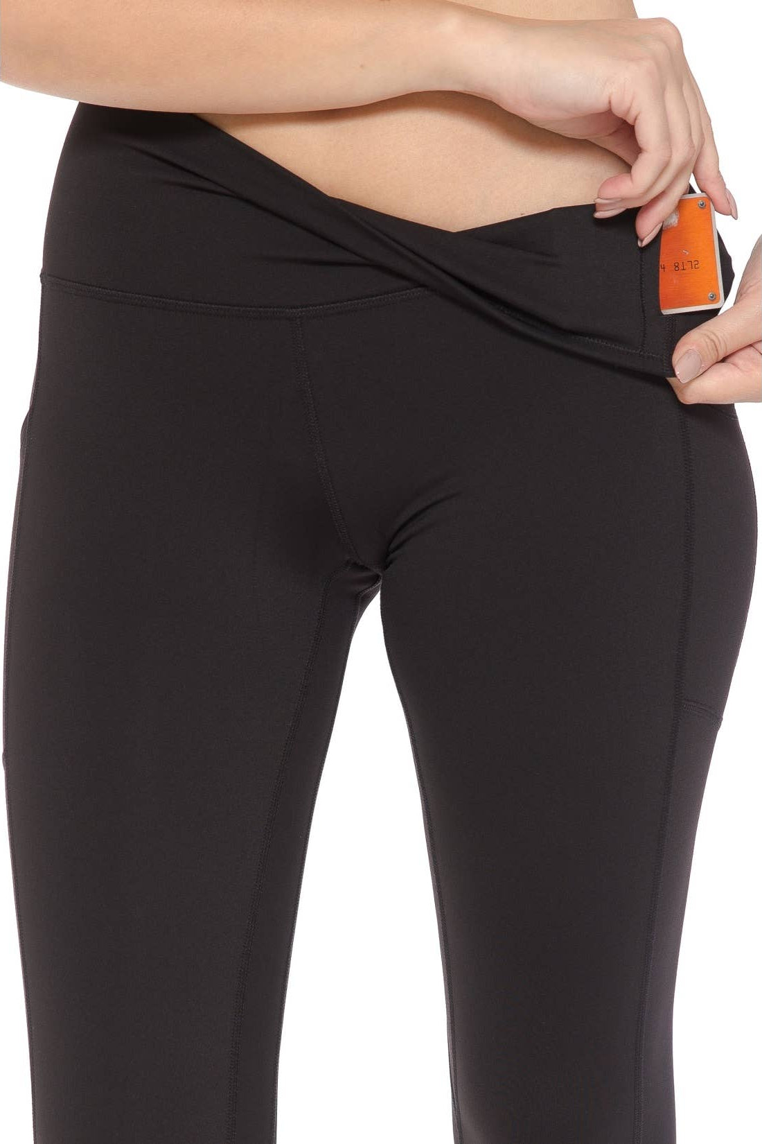 Black leggings with a pocket on a white background
