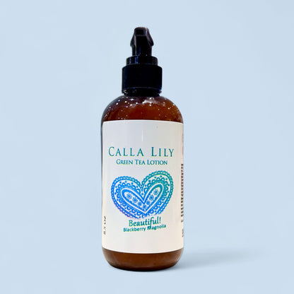 Calla Lily green tea lotion bottle with a heart design on a light blue background. Blackberry Magnolia Cream Lotion