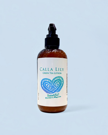 Calla Lily green tea lotion bottle with a heart design on a light blue background. Blackberry Magnolia Cream Lotion