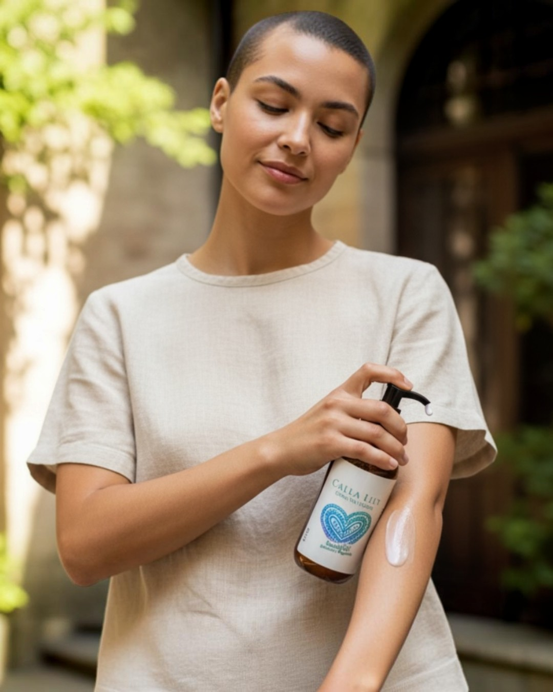 Woman applying sunscreen to her arm outdoors
