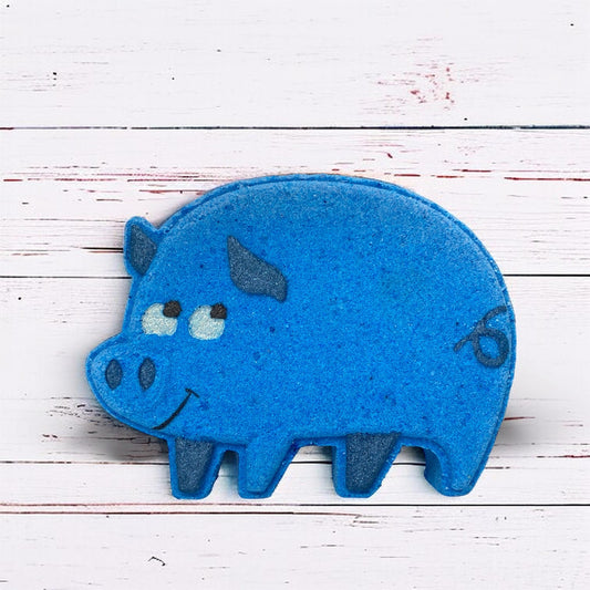 Blue pig-shaped object on a white wooden surface