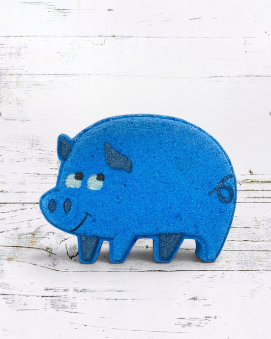 Blue pig-shaped object on a white wooden surface