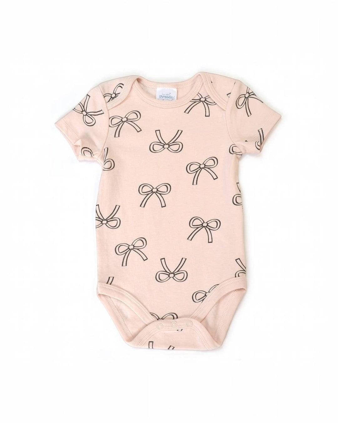 Baby onesie with bow pattern on a white background