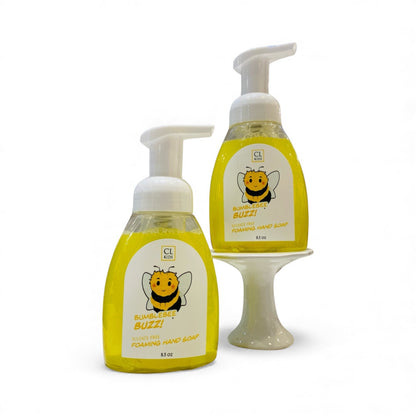 Two bottles of CL Buzz foaming hand soap on a white background