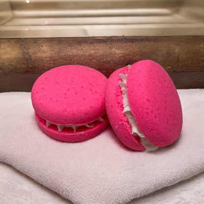 Two pink piggy snorts bath cookies laying on a towel