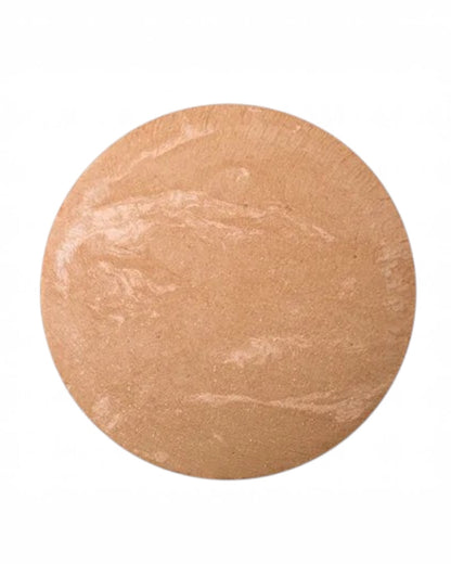 Round beige makeup compact on a white background