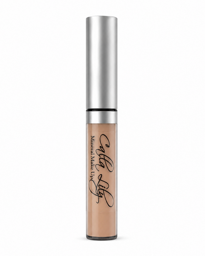 Cosmetic concealer with silver applicator on a white background