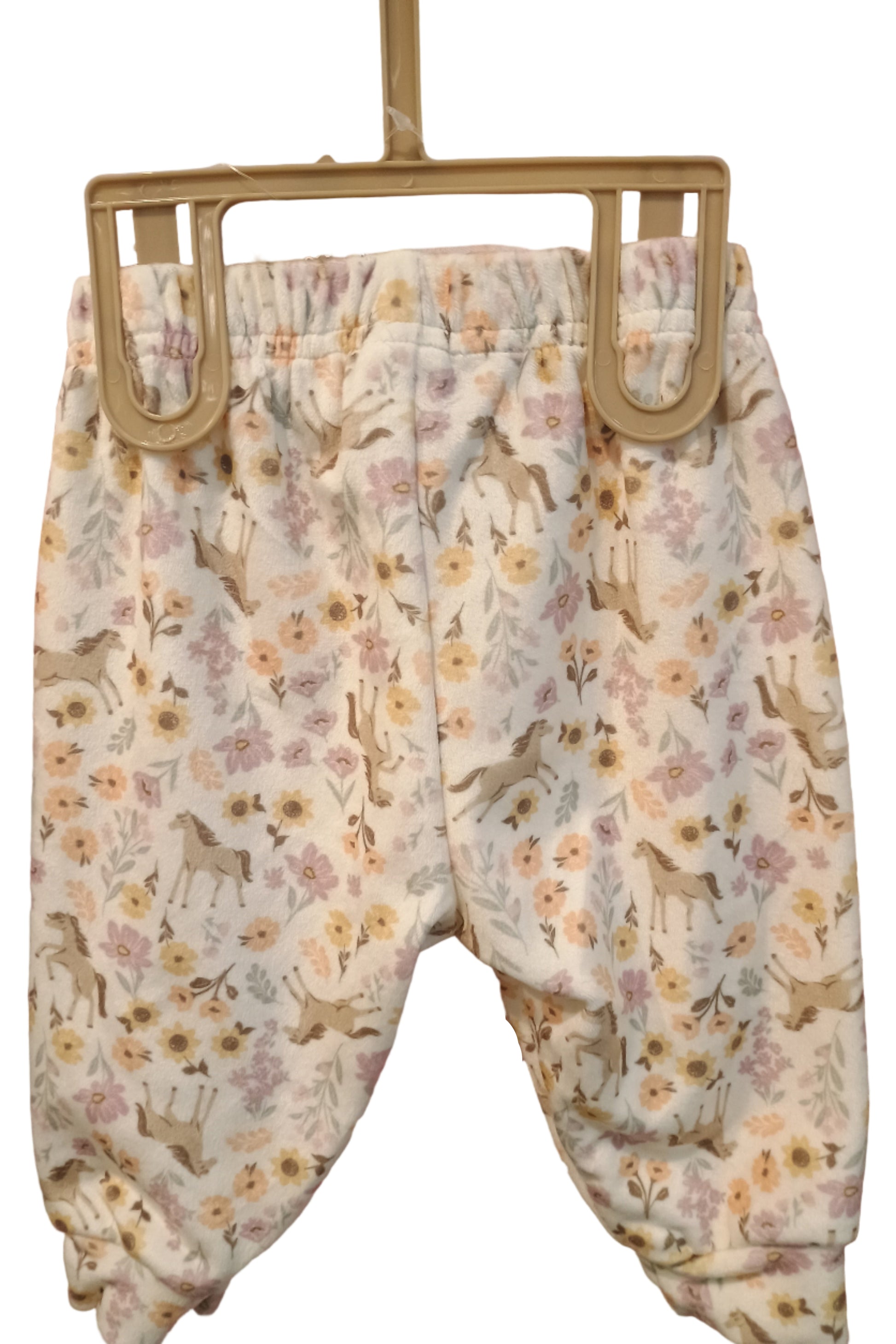 Pants with flowers and horses on white background