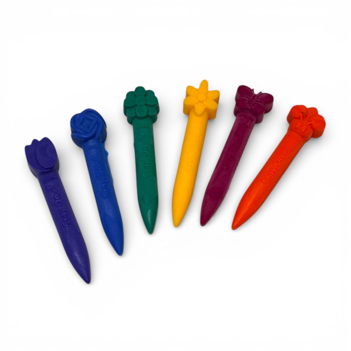 Set of colorful plastic golf tees with decorative ends on a white background
Chubby Flower Bath Crayon Set