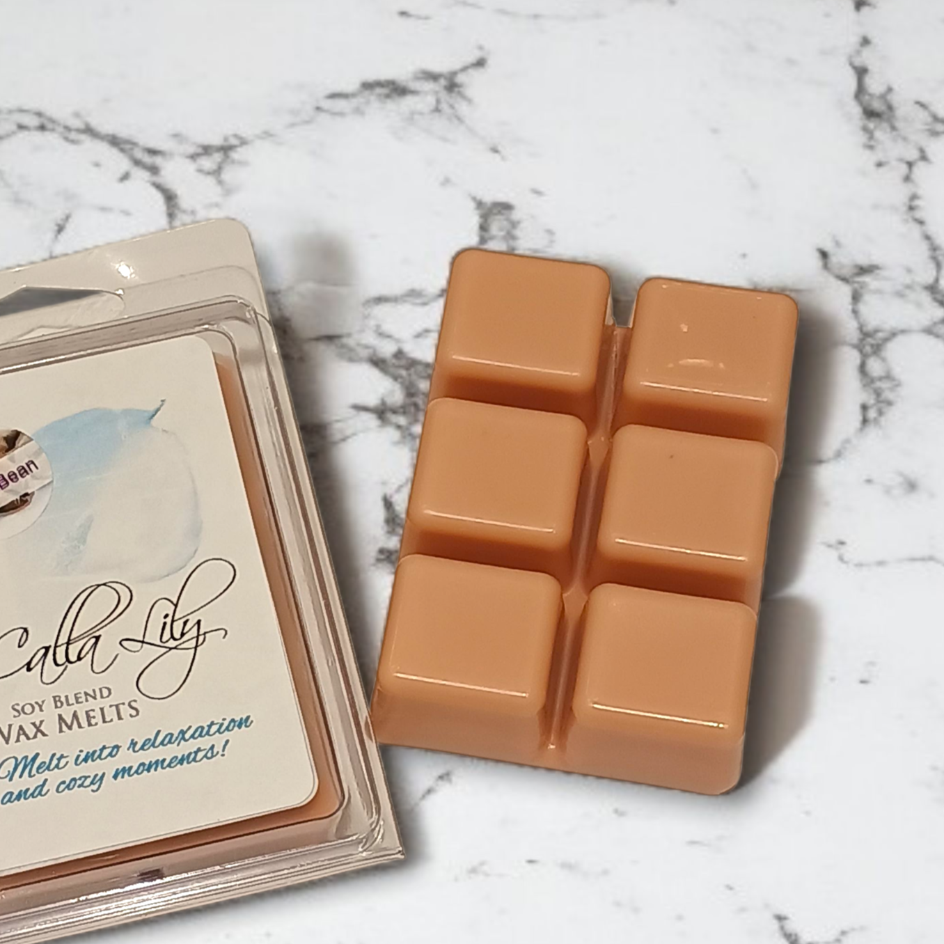 Calla Lily wax melts packaging with six square wax melts on a marble surface