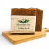 Handcrafted Coffee Scrub soap on a wooden tray with a white background