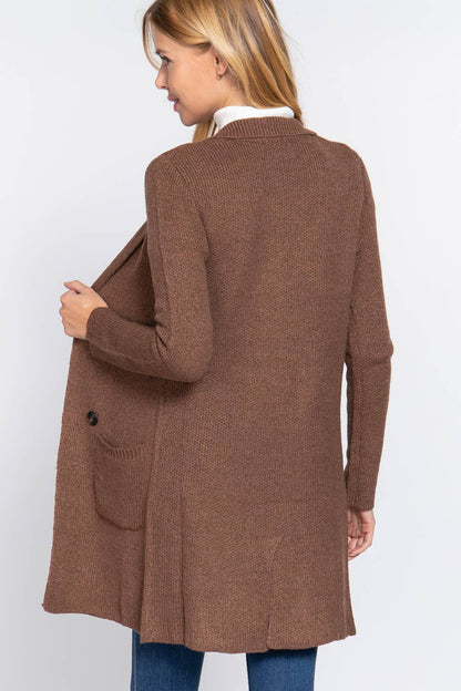Woman wearing a brown cardigan on a white background