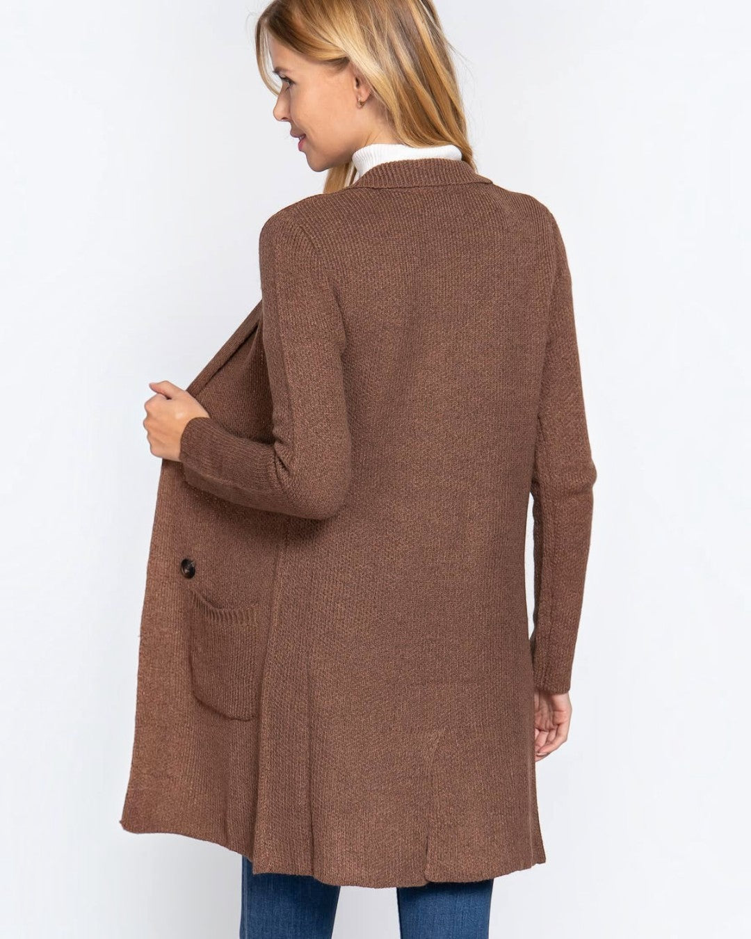 Woman wearing a brown cardigan on a white background