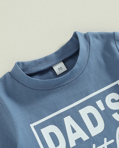 Blue t-shirt with 'DAD'S' text on a light gray background