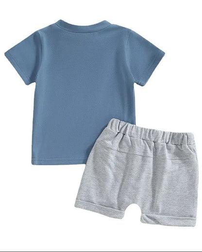 blue shirt and grey shorts