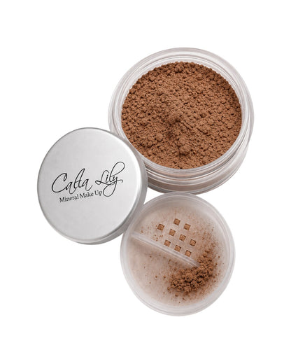 Open container of Cleta Lily mineral makeup powder on a white background