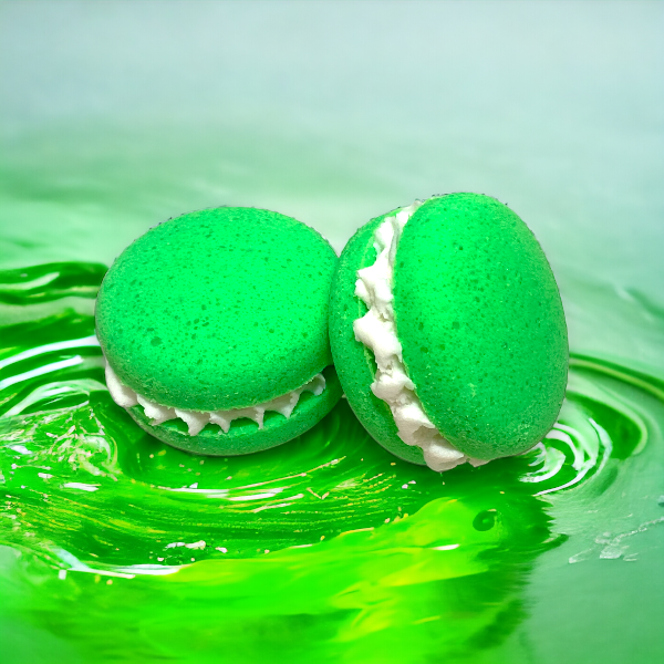 Two green dino burps bath cookies against a green watery background