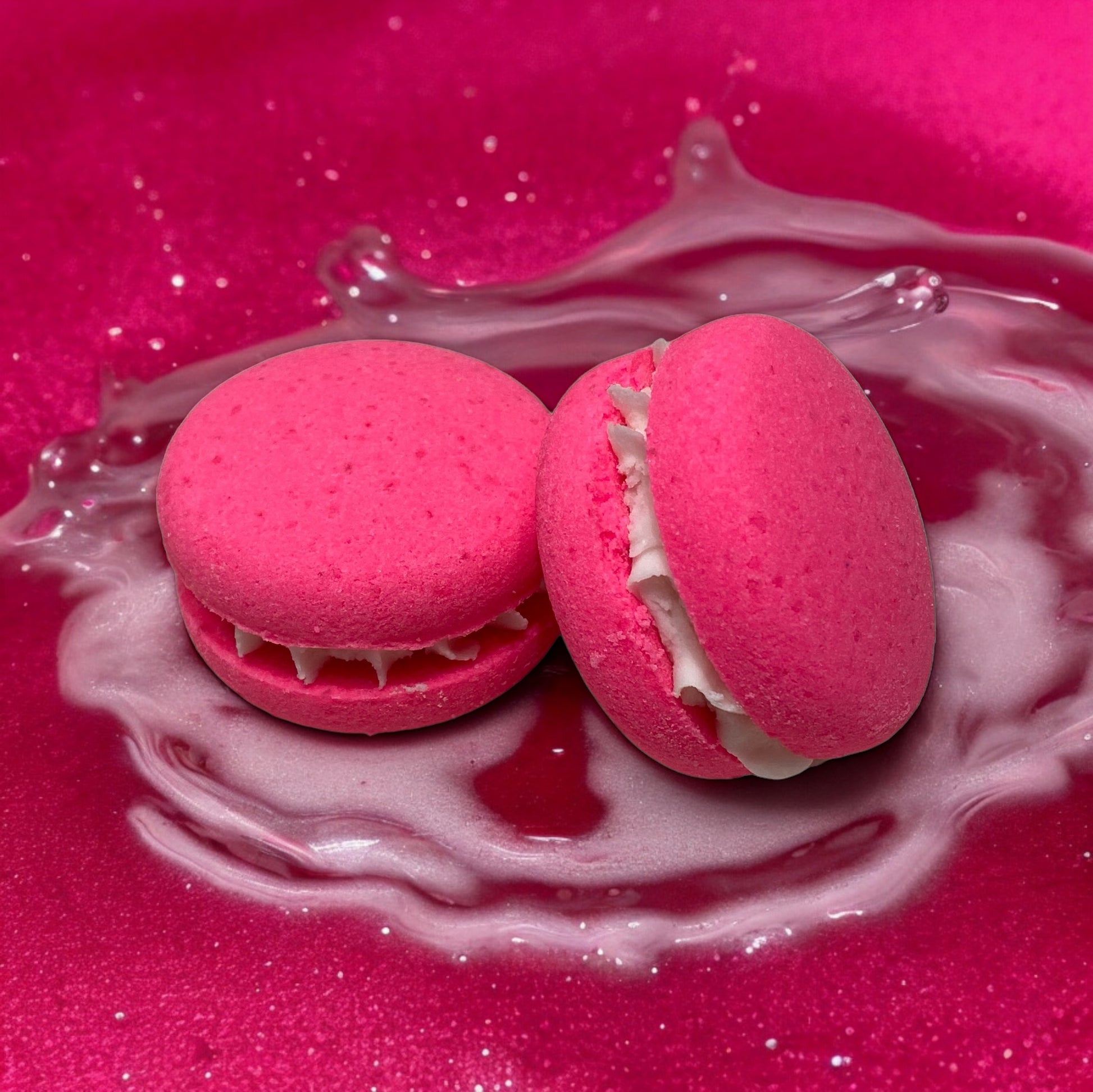 Two pink piggy snorts bath cookies against a glittery pink background