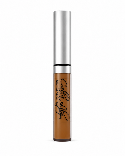 Cosmetic tube with silver cap and brown body on a white background