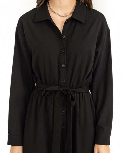 Black dress with a belt on a white background